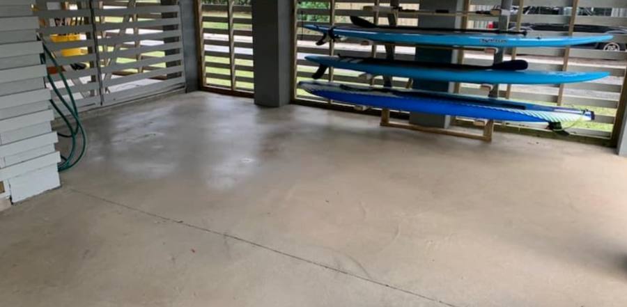 Same concrete patio clean after pressure washing