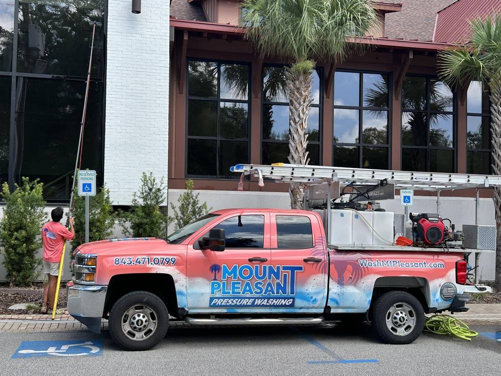 Mount Pleasant Pressure Washing truck on a commercial window cleaning job